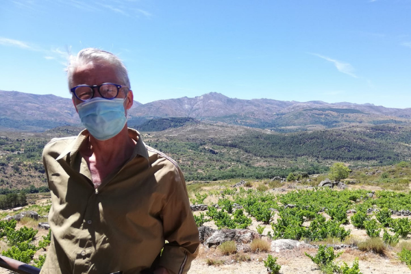 William visiting vineyards in a mask